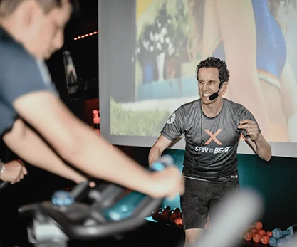 Coach giving spinning class